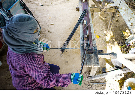 Worker doing the steelwork for reinforcement Worker doing the steelwork for reinforcement 43478128