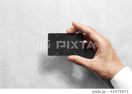 Hand hold blank black craft card mockup with rounded corners Hand hold blank black craft card mockup with rounded corners 43479971