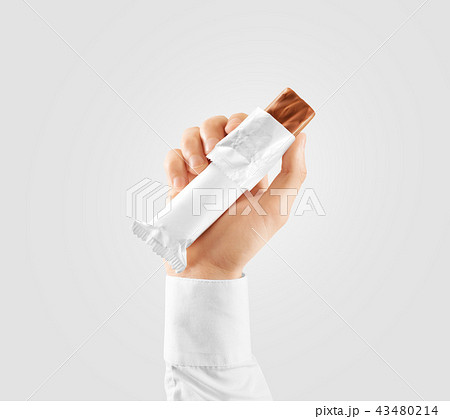 Blank white candy bar plastic wrap opened mockup hold hand Blank white candy bar plastic wrap opened mockup hold hand 43480214