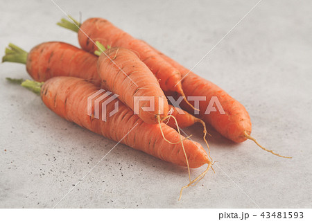 Raw carrots on a white background. Raw carrots on a white background. 43481593