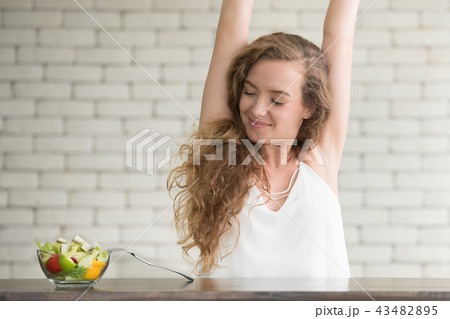 Young woman in joyful postures with salad bowl Young woman in joyful postures with salad bowl 43482895