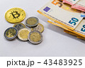 Golden Bitcoin cryptocurrency on Euro banknotes. N 43483925