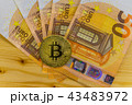 Golden Bitcoin cryptocurrency on Euro banknotes. N 43483972