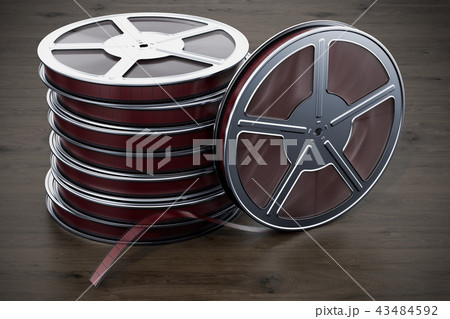 Cinema concept. Film reels on the wooden table 43484592