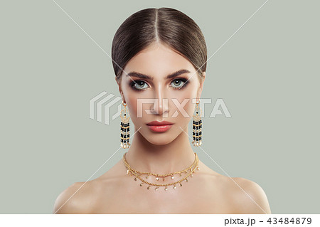 Gorgeous woman with makeup and fashion jewelry 43484879