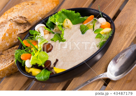 Mushroom cream soup with grain bread Mushroom cream soup with grain bread 43487179