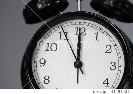 clock showing at noon clock showing at noon 43492425