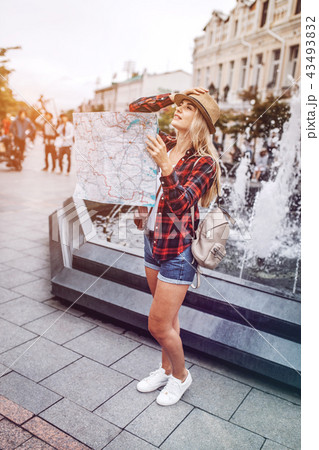 Woman with map being lost in city Woman with map being lost in city 43493832