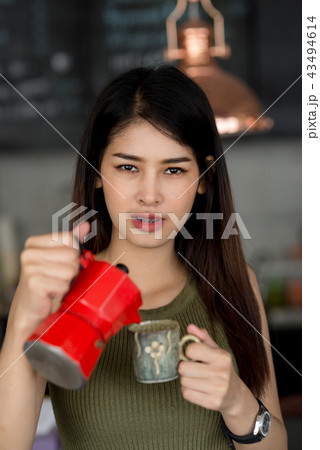 Asian barista working in cafe. Asian barista working in cafe. 43494614