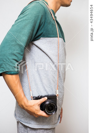 men with leather camera strap on white background 43494654