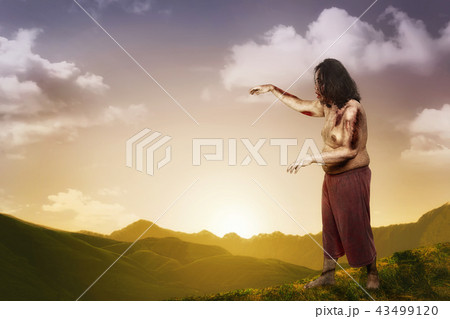 Spooky zombie man with wounded body 43499120