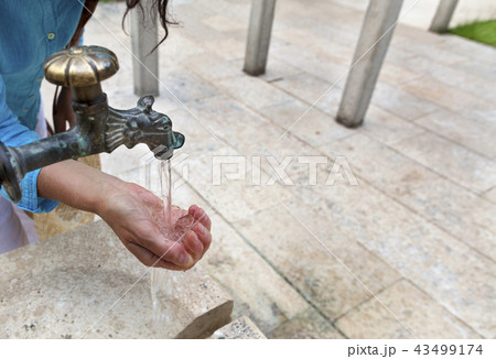 Spring pure transparent water is pouring Spring pure transparent water is pouring 43499174