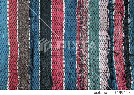 Texture of multi-colored homespun rug. Traditional Texture of multi-colored homespun rug. Traditional 43499418