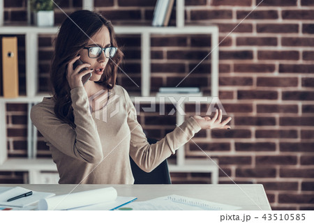 Young Business Woman Talking on Cellphone at Home 43510585