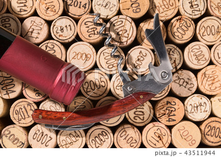 Elegant, already open corkscrew on winecorks 43511944
