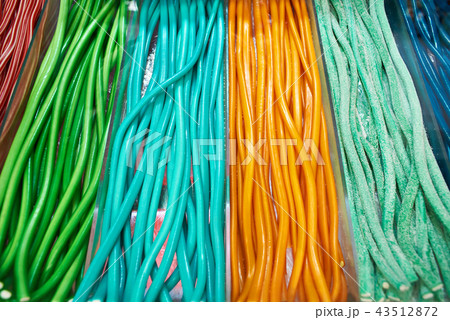 Long colorful marmalade on shelf of pastry shop 43512872