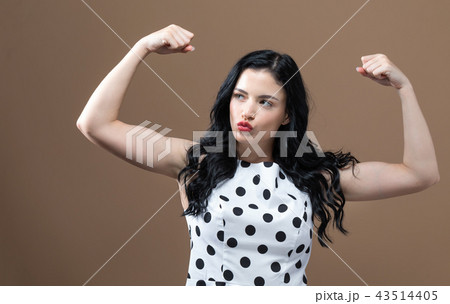 Powerful young woman in success pose 43514405