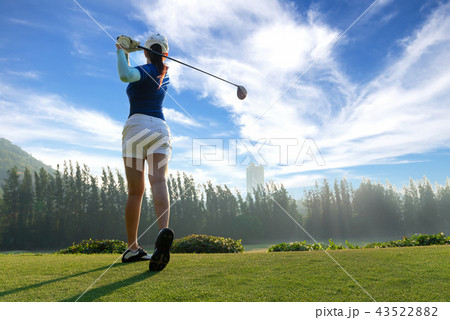 Asian woman golf player doing golf swing tee off  43522882