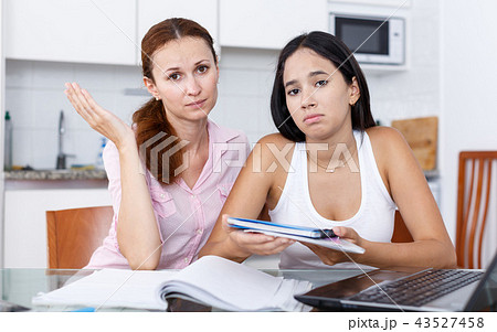 Mother calming daughter Mother calming daughter 43527458