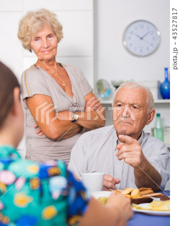 Stressed senior couple having conversation with female Stressed senior couple having conversation with female 43527817