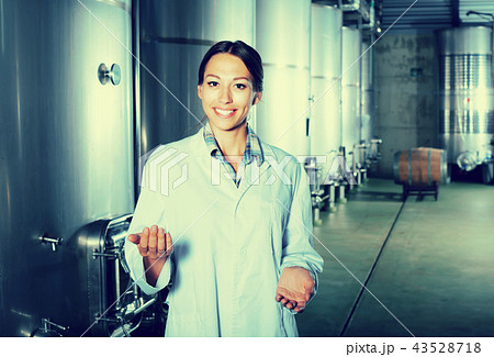 Portrait of female employee winery worker. 43528718