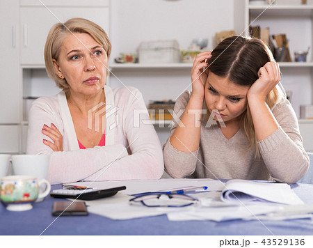mother and her adult daughter with financial problems mother and her adult daughter with financial problems 43529136