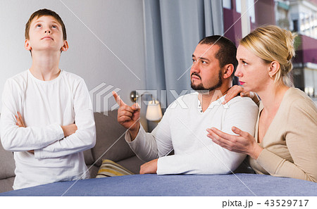 Upset parents berating son 43529717