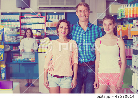 family in pharmaceutical store . 43530614