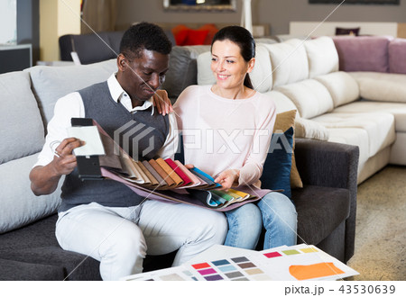 Active couple is choosing colors for furniture 43530639