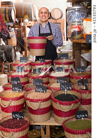 man selling dried beans 43530793
