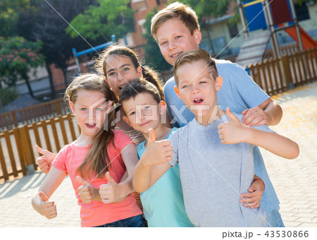 Children posing at the playground and thumbs up 43530866