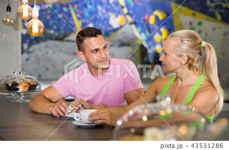 Athletic people on break during indoor climbing workout 43531286