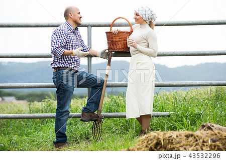 Two positive farm workers taking a pause Two positive farm workers taking a pause 43532296