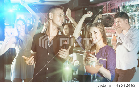 Man with woman are drinking cocktails on corporate party. Man with woman are drinking cocktails on corporate party. 43532465