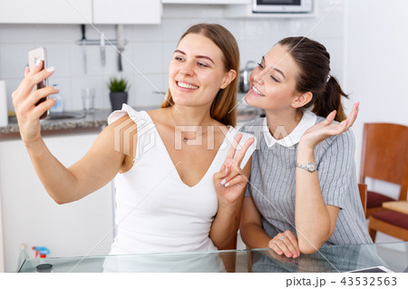 Two young girls taking selfie 43532563