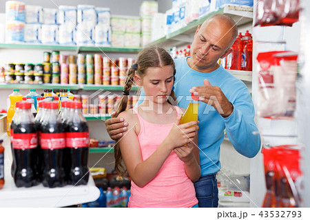 father and girl buying drinks father and girl buying drinks 43532793
