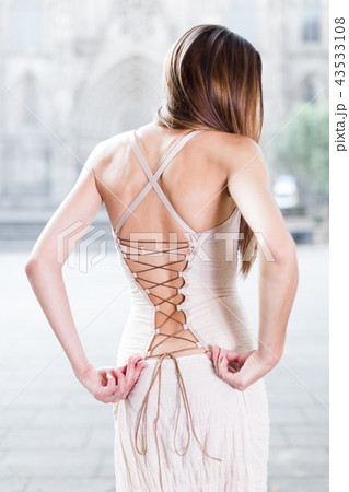 close-up portrait of young female with long hair in romantic ivory midi gown close-up portrait of young female with long hair in romantic ivory midi gown 43533108