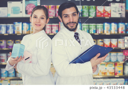 Portrait of glad expert and female pharmacist Portrait of glad expert and female pharmacist 43533448