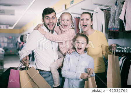 family of four with shopping bags 43533762