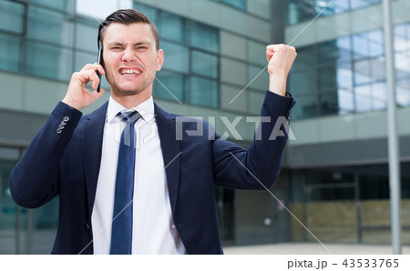 Manager is happy after agreed about the successful transaction Manager is happy after agreed about the successful transaction 43533765