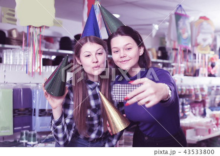 Two young female friends taking selfie Two young female friends taking selfie 43533800