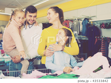 Family buying children clothes Family buying children clothes 43533842