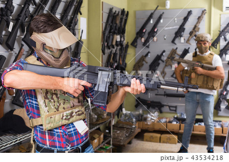 men in army uniform with gun in military market 43534218