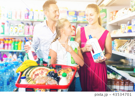 Attractive people showing household goods purchase Attractive people showing household goods purchase 43534701