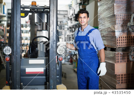 Portrait of adult sellerman in uniform in workplace 43535450