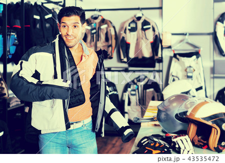 Man trying up moto jacket Man trying up moto jacket 43535472