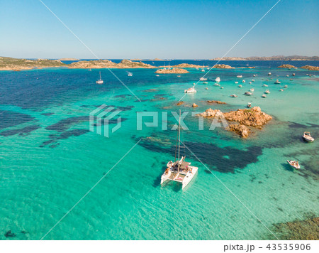 Drone aerial view of catamaran sailing boat in Maddalena Archipelago, Sardinia, Italy. 43535906
