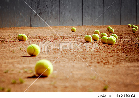 Tennis balls on tennis grass court, after the game 43536532