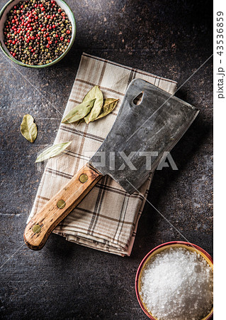 Old meat butcher on dark concrete board 43536859