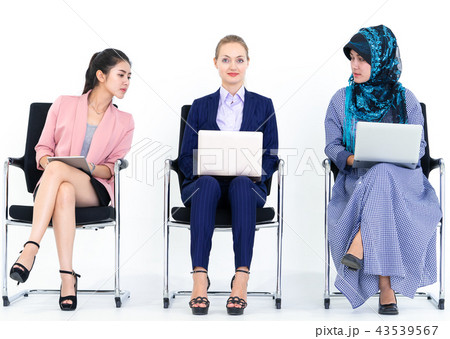 Sneaky business woman looking at people computer 43539567